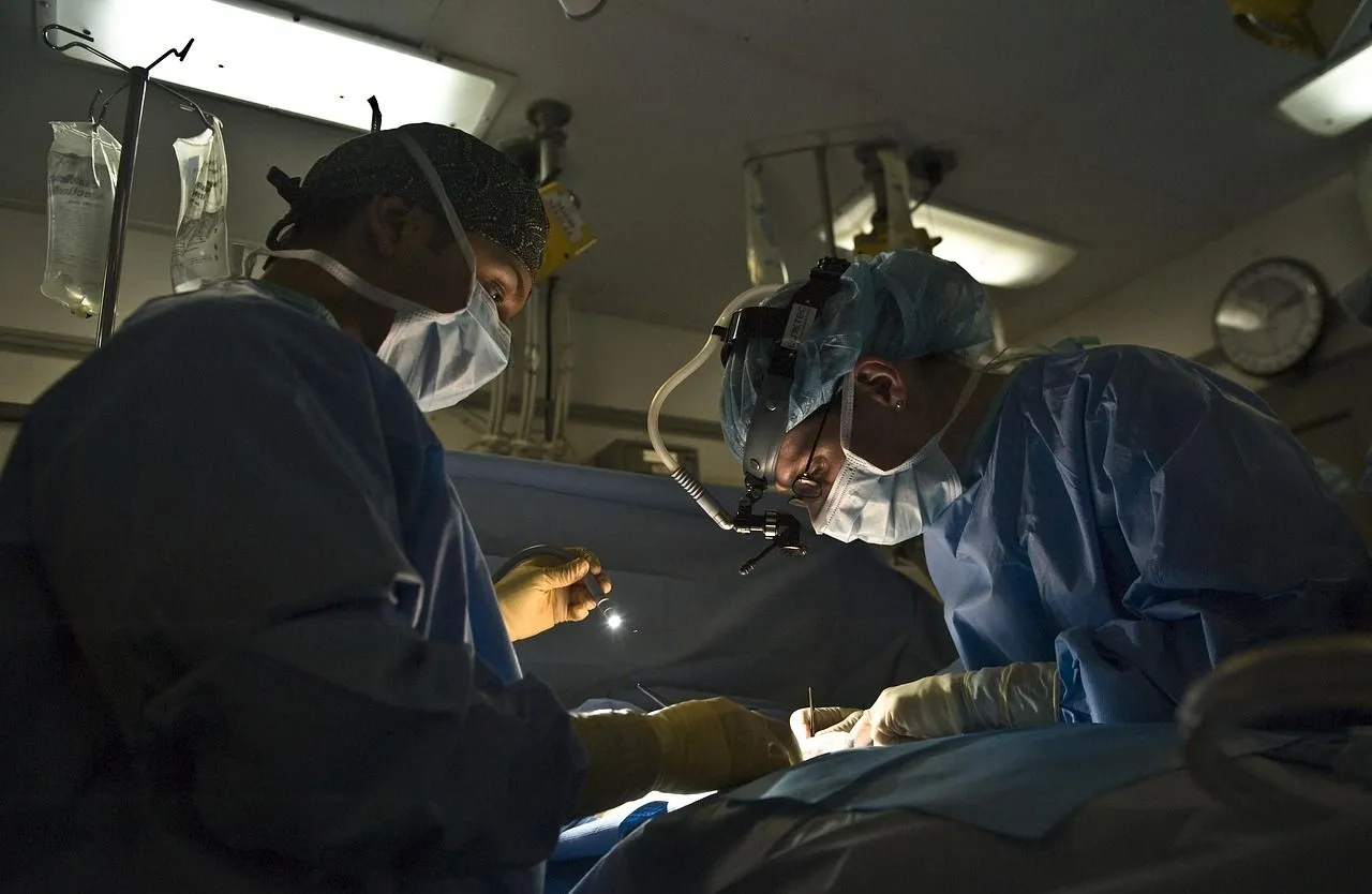 Surgeons working on a patient with magnifier. 