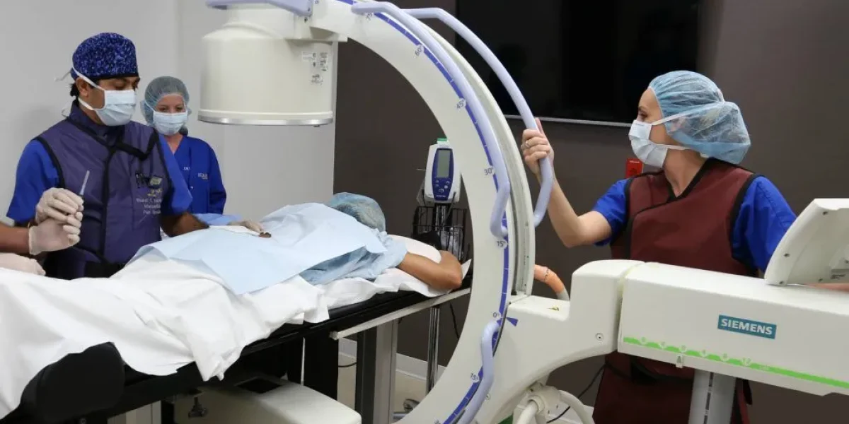 Medical team performing a procedure using advanced imaging technology.